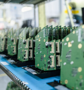 Printed circuit board assemblies (PCBAs) in production at Dynamic Source Manufacturing Inc., showcasing high-reliability electronics manufacturing and assembly capabilities.