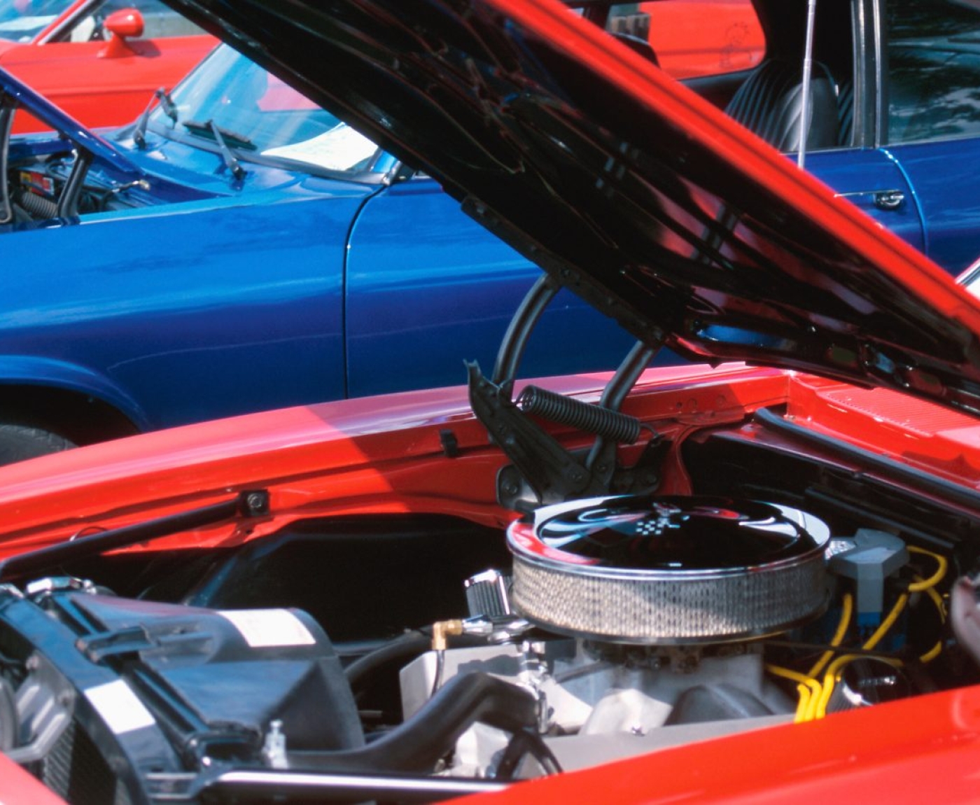 Photo of car with hood open.